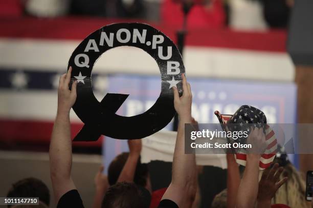 Guests cheer for President Donald Trump as he speaks at a rally to show support for Ohio Republican congressional candidate Troy Balderson on August...