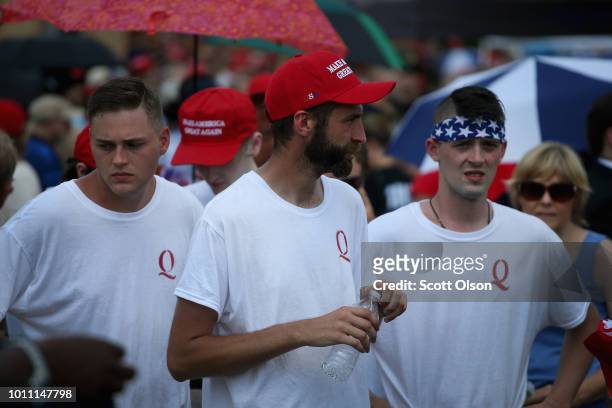 Guests attend a rally where President Donald Trump was speaking to show support for Ohio Republican congressional candidate Troy Balderson on August...