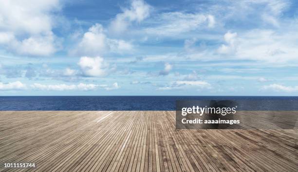 empty deck against sea and sky - holzbrett himmel stock-fotos und bilder