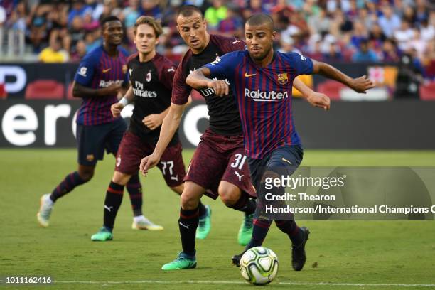 Rafinha of FC Barcelona controls the ball against Luca Antonelli of AC Milan during their International Champions Cup match at Levi's Stadium on...