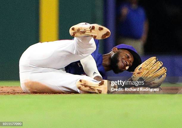 Jurickson Profar of the Texas Rangers smiles at the ball in his glove after catching it for the final out of the baseball game agaisnt the Baltimore...