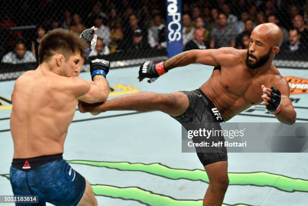 Demetrious Johnson kicks Henry Cejudo in their UFC flyweight championship fight during the UFC 227 event inside Staples Center on August 4, 2018 in...