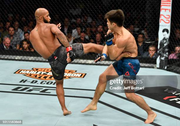 Demetrious Johnson kicks Henry Cejudo in their UFC flyweight championship fight during the UFC 227 event inside Staples Center on August 4, 2018 in...