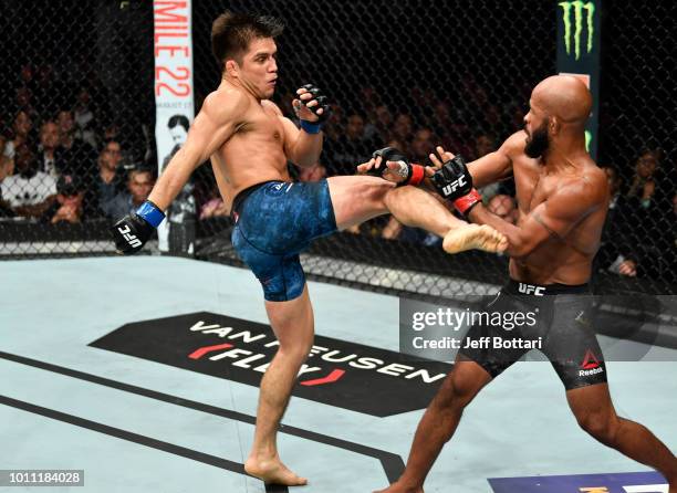 Henry Cejudo kicks Demetrious Johnson in their UFC flyweight championship fight during the UFC 227 event inside Staples Center on August 4, 2018 in...