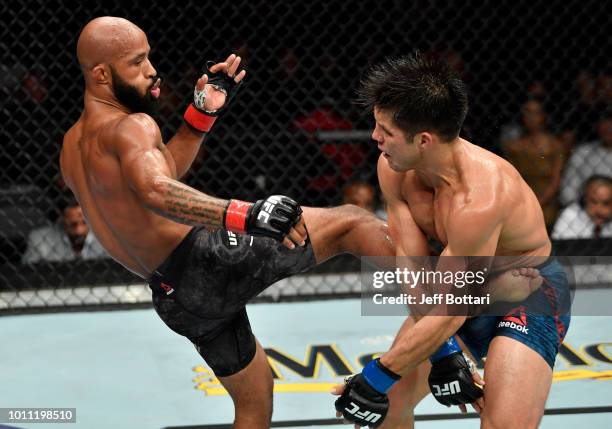 Demetrious Johnson kicks Henry Cejudo in their UFC flyweight championship fight during the UFC 227 event inside Staples Center on August 4, 2018 in...