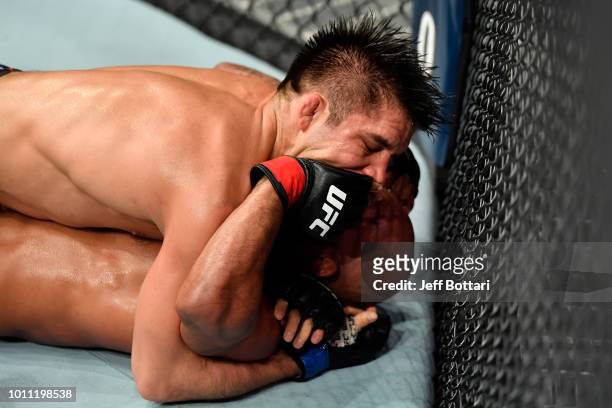 Henry Cejudo battles Demetrious Johnson in their UFC flyweight championship fight during the UFC 227 event inside Staples Center on August 4, 2018 in...