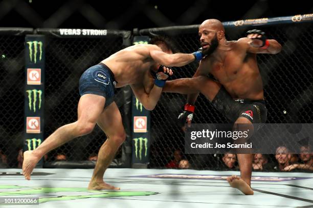 Demetrious Johnson is taken to the ground by Henry Cejudo in the fourth round of the UFC Flyweight Title Bout during UFC 227 at Staples Center on...