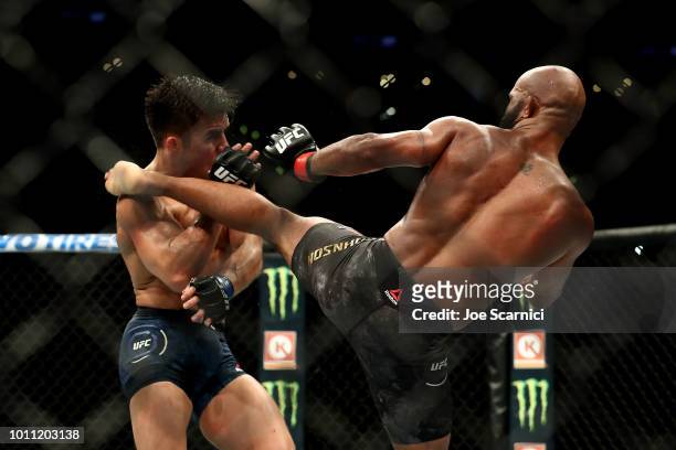 Demetrious Johnson kicks Henry Cejudo in the fifth round of the UFC Flyweight Title Bout during UFC 227 at Staples Center on August 4, 2018 in Los...