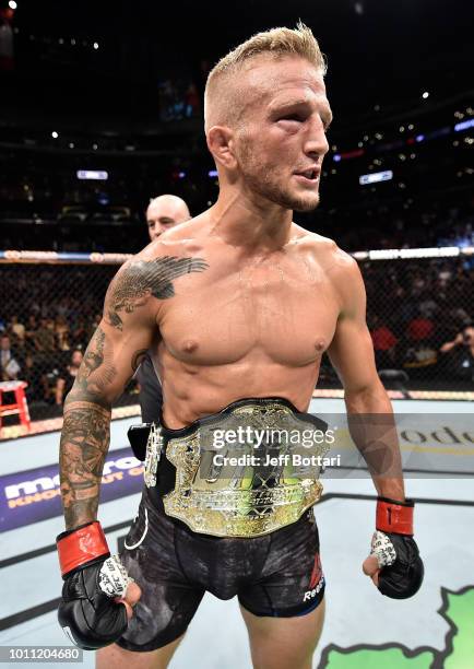 Dillashaw celebrates after his knockout victory over Cody Garbrandt in their UFC bantamweight championship fight during the UFC 227 event inside...