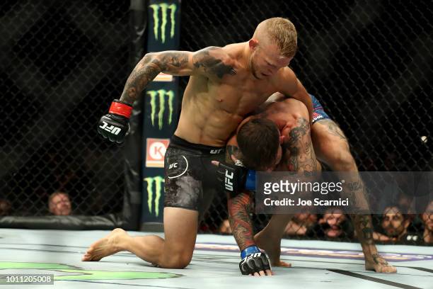 Dillashaw punches Cody Garbrandt in the first round of the UFC Bantamweight Title Bout during UFC 227 at Staples Center on August 4, 2018 in Los...
