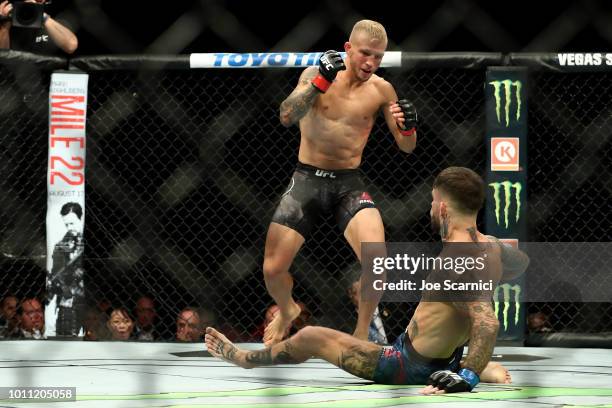 Dillashaw knocks down Cody Garbrandt in the first round of the UFC Bantamweight Title Bout during UFC 227 at Staples Center on August 4, 2018 in Los...