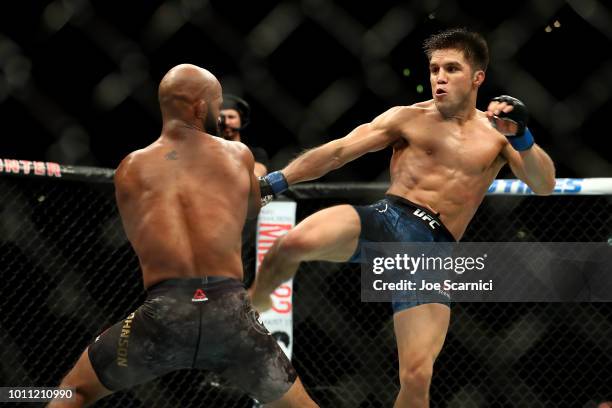 Henry Cejudo kicks Demetrious Johnson in the second round of the UFC Flyweight Title Bout during UFC 227 at Staples Center on August 4, 2018 in Los...