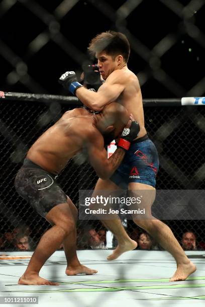 Henry Cejudo and Demetrious Johnson spar off in the first round of the UFC Flyweight Title Bout during UFC 227 at Staples Center on August 4, 2018 in...