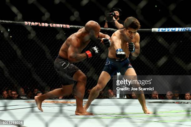 Henry Cejudo throws a punch in the first round at Demetrious Johnson in the UFC Flyweight Title Bout during UFC 227 at Staples Center on August 4,...