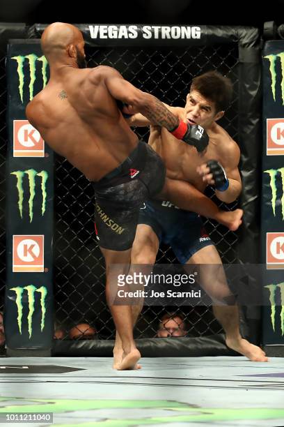 Demetrious Johnson kicks Henry Cejudo in the first round of the UFC Flyweight Title Bout during UFC 227 at Staples Center on August 4, 2018 in Los...