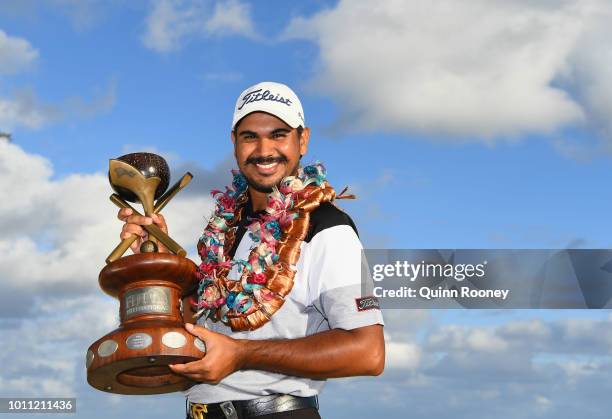 Gaganjeet Bhullar of India poses with the trophy after winning during Day Four at the Fiji International Golf Tournament on August 5, 2018 in...