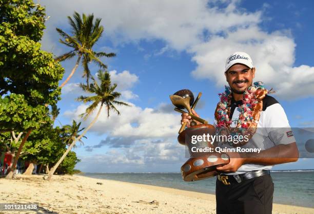 Gaganjeet Bhullar of India poses with the trophy after winning during Day Four at the Fiji International Golf Tournament on August 5, 2018 in...