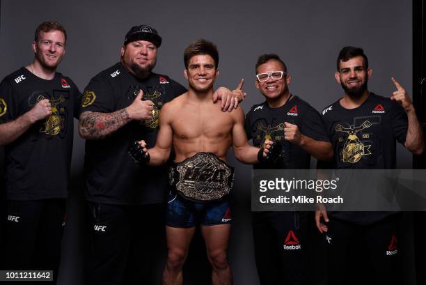 Henry Cejudo poses for a portrait backstage with his team after his victory over Demetrious Johnson during the UFC 227 event inside Staples Center on...