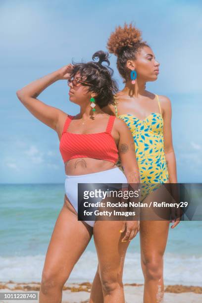 Two young confident women on the beach
