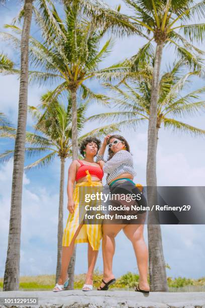 Two young confident women standing outside