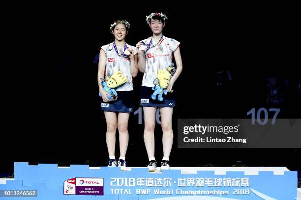 Mayu Matsumoto and Wakana Nagahara of Japan pose with their medals during the Women's Doubles awarding ceremony after defeating Yuki Fukushima and...