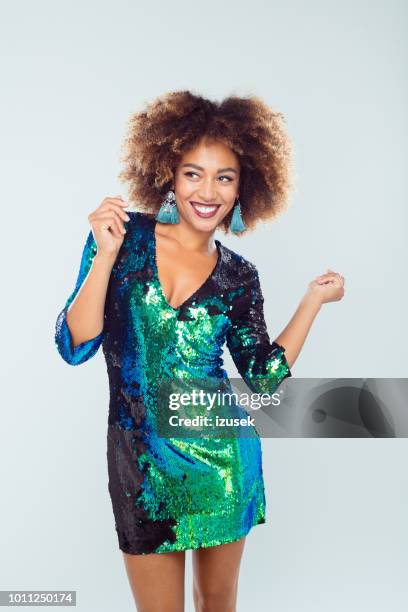 glamorous woman dancing - black sequin dress stock pictures, royalty-free photos & images