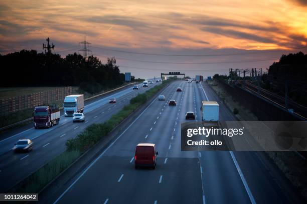 highway - view from a bridge at dusk - autobahn stock pictures, royalty-free photos & images