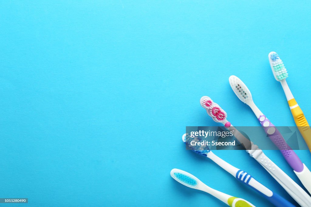 Toothbrushes on blue background