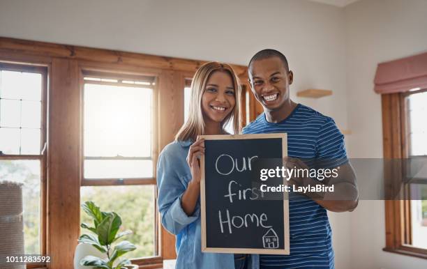 we're making big moves - couple placard stock pictures, royalty-free photos & images