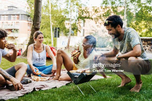 group of friends having bbq by canal - leipzig saxony stock pictures, royalty-free photos & images