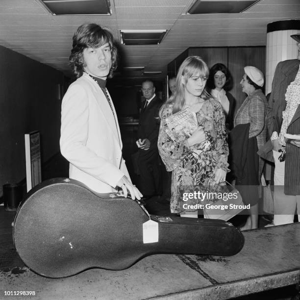 Mick Jagger and Marianne Faithfull arrive at London Airport , after a flight from Dublin, 14th August 1967.