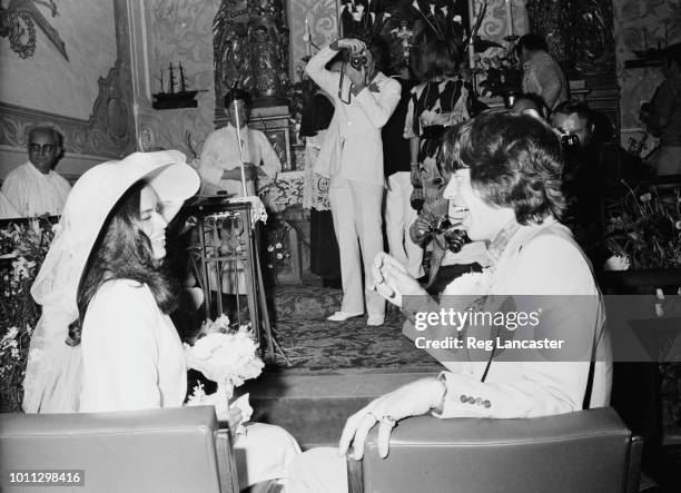 Mick and Bianca Jagger at their wedding at the Church of St. Anne, St Tropez, 12th May 1971. In the background is British photographer, Patrick...
