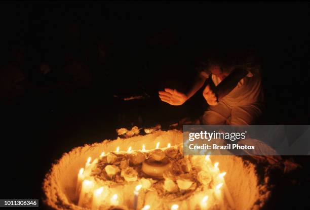 Afro-Brazilian religious ritual at Copacabana beach in Rio de Janeiro, Brazil, during New Year celebration - offerings to the entities.