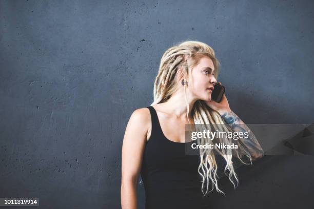woman with dreadlocks making a phone call - white rasta stock pictures, royalty-free photos & images