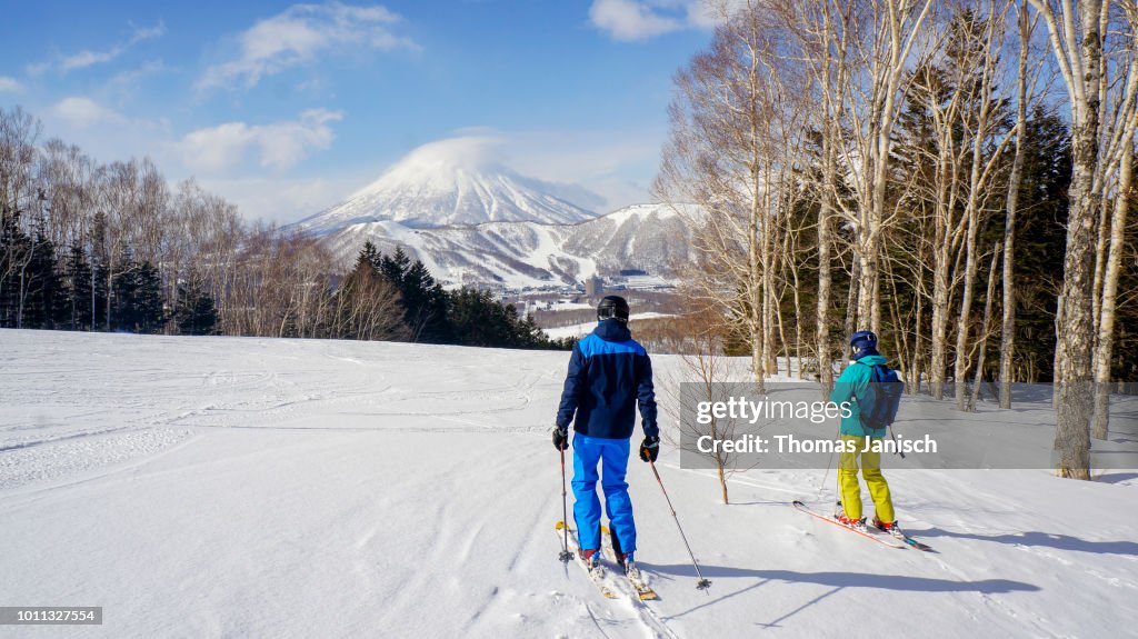 Skiing at Rusutsu Ski Resort with a view on Mount Yotei, Japan