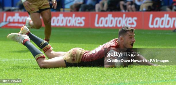 Catalans Dragons' Benjamin Garcia scores his sides 4th try during the Ladbrokes Challenge Cup Semi Final match at the Macron Stadium, Bolton.