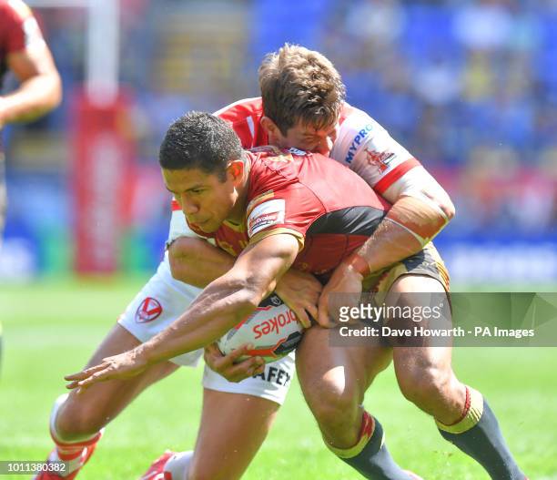 St Helens' Louie McCarthy-Scarsbrook and Catalans Dragons' David Mead during the Ladbrokes Challenge Cup Semi Final match at the Macron Stadium,...