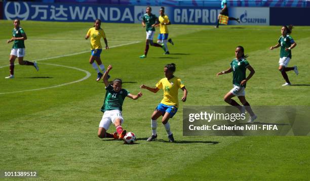 Jacqueline Ovalle of Mexico tackles Katrine of Brazil during the FIFA U-20 Women's World Cup France 2018 group B match between Mexico and Brazil at...