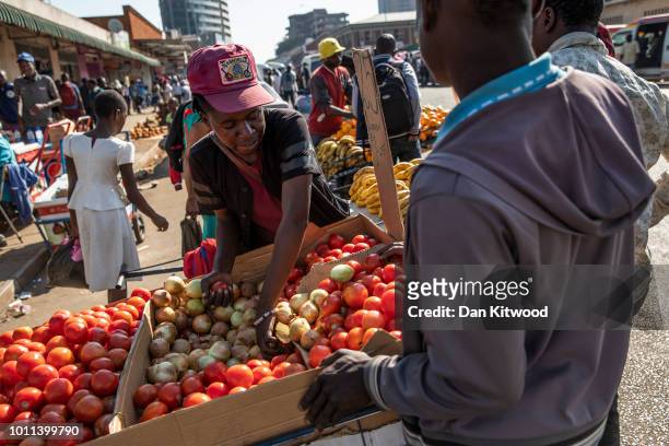 Street vendors sell goods in a market on August 05, 2018 in Harare, Zimbabwe. Zimbabwe Electoral Commission officials have announced the re-election...