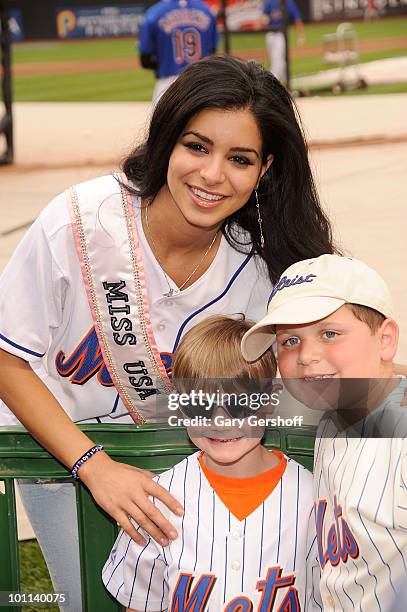 Miss USA Rima Fakih poses for pictures with fans at Citi Field on May 27, 2010 in the Queens Borough of New York City.