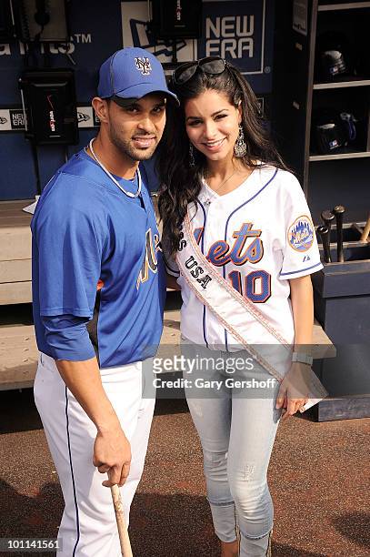 Miss USA Rima Fakih poses for pictures with N.Y Met's Angel Pagan at Citi Field on May 27, 2010 in the Queens Borough of New York City.