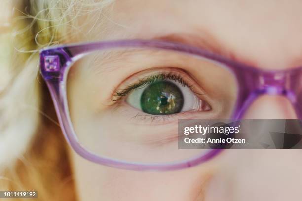 close up of girl with glasses eye - child eyes stock pictures, royalty-free photos & images