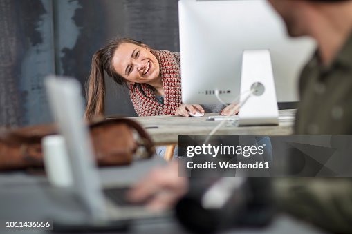Woman Head Over Computer Screen Happy Young Woman Peeking Around Computer Screen In Office High-Res ...