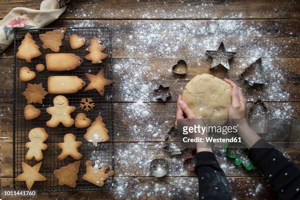 woman's hands kneading dough for gingerbread cookies - teig kneten stock-fotos und bilder