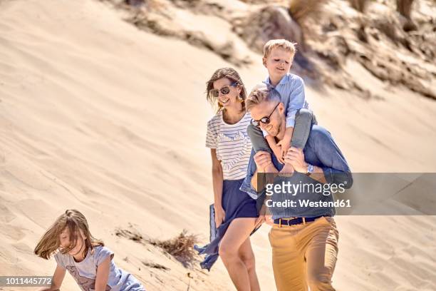 happy family walking on the beach together - adelaide people stock pictures, royalty-free photos & images