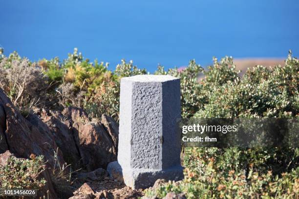 milestone on the top of a mountain - mile stone stock pictures, royalty-free photos & images