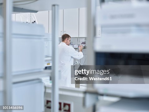 Chemist working in laboratory Chemist working in laboratory