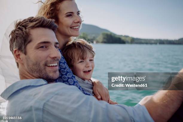 happy family on a sailing trip - father son sailing stock pictures, royalty-free photos & images