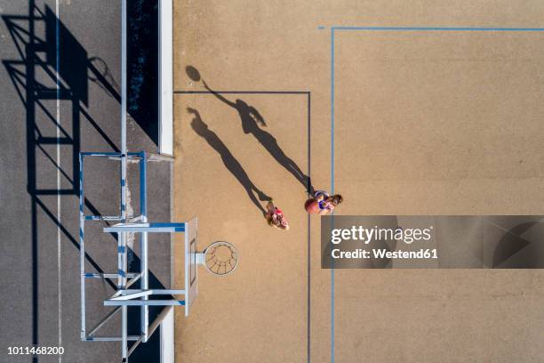 young women playing basketball, aerial view - basketball blocking shot stock pictures, royalty-free photos & images