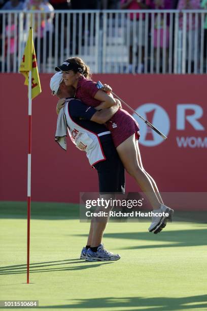 Georgia Hall of England hugs her caddy after finishing the final round and winning the tournament during day four of Ricoh Women's British Open at...